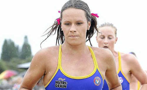 Courtney Hancock grits her teeth as she chases Liz Pluimers in the Ironwoman event at Coolum. Courtney Hancock grits her teeth as she chases Liz Pluimers in the Ironwoman event at Coolum.